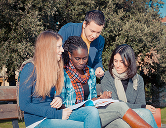 Students sitting on a park bench